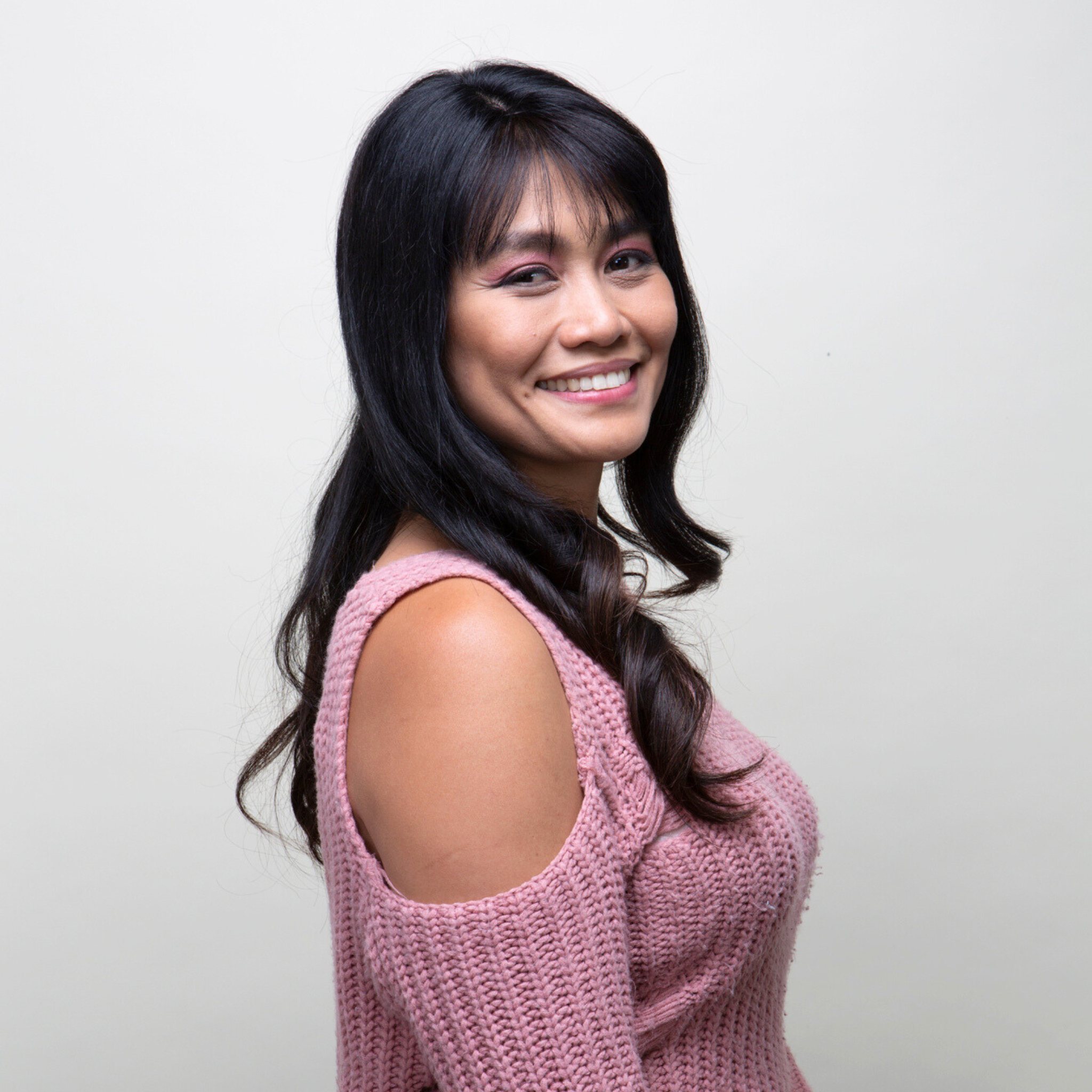 Side view image of a woman displaying a French top Remy human hair topper.